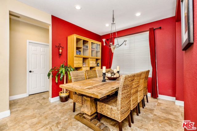 dining area with a notable chandelier