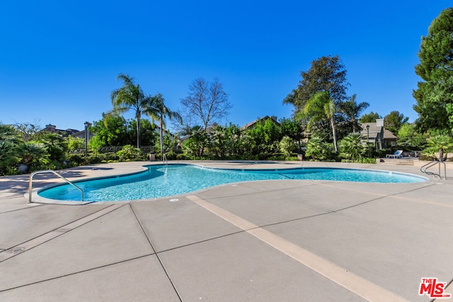 view of pool featuring a patio area