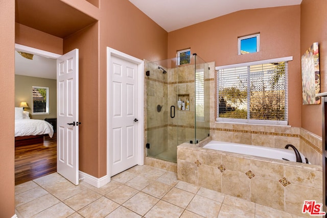 bathroom featuring tile patterned floors and plus walk in shower