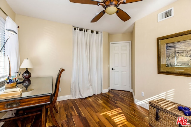 home office with ceiling fan and dark hardwood / wood-style floors