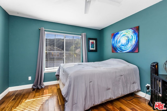 bedroom featuring ceiling fan and hardwood / wood-style flooring