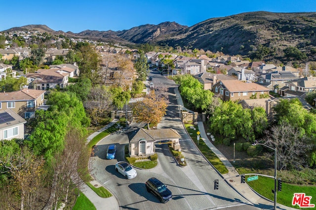 birds eye view of property with a mountain view