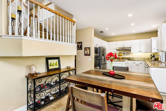 tiled dining space with sink