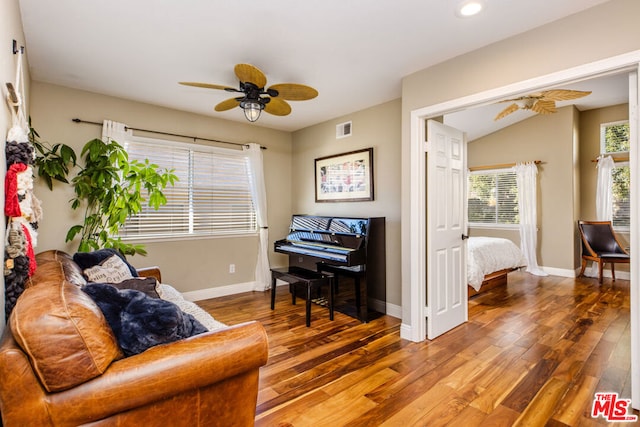 interior space with ceiling fan, vaulted ceiling, and hardwood / wood-style floors