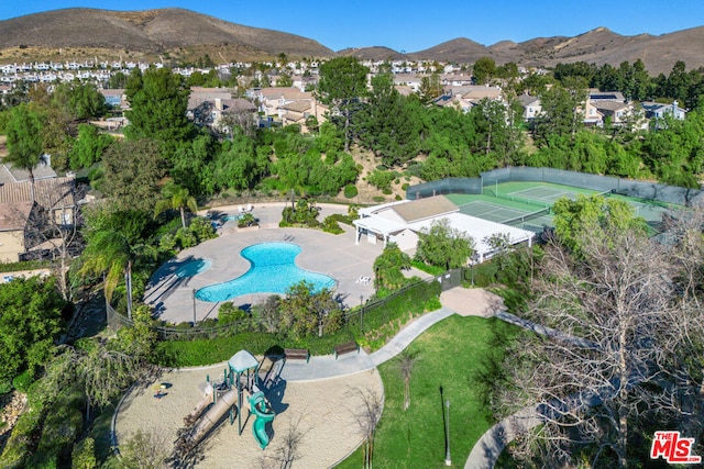 birds eye view of property with a mountain view