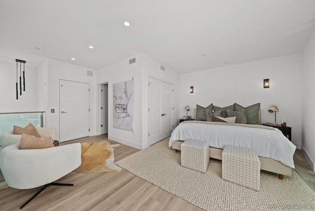 bedroom with light hardwood / wood-style flooring