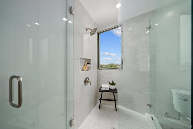 bathroom with toilet and walk in shower