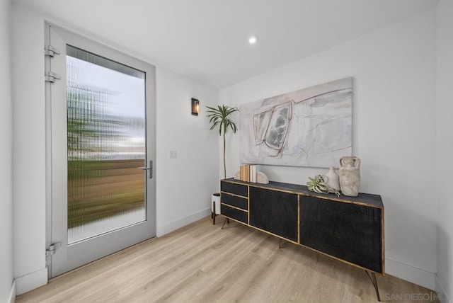 doorway to outside featuring light hardwood / wood-style flooring