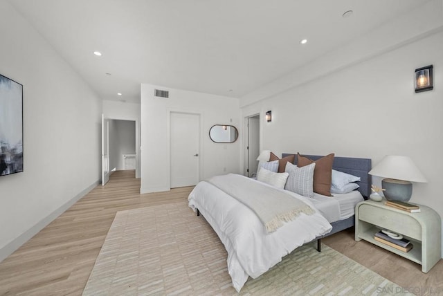 bedroom with light hardwood / wood-style flooring