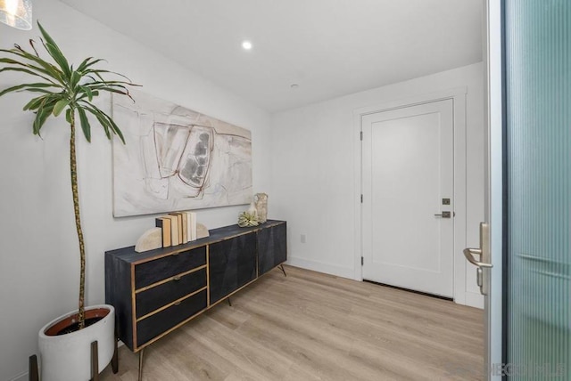 foyer entrance with light hardwood / wood-style floors