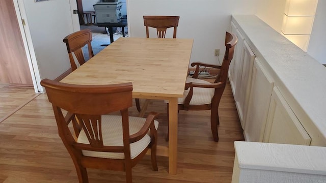 dining space with light hardwood / wood-style floors