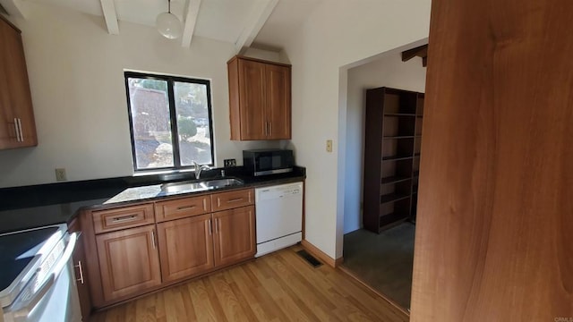 kitchen with light hardwood / wood-style floors, sink, dishwasher, range, and beamed ceiling