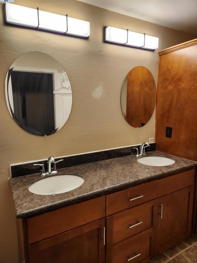 bathroom featuring tile patterned floors and vanity