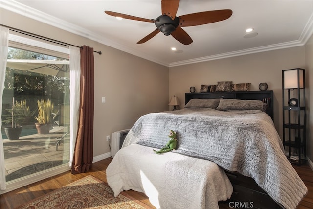 bedroom with ceiling fan, crown molding, and hardwood / wood-style floors