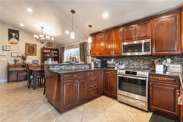 kitchen featuring tasteful backsplash, vaulted ceiling, pendant lighting, stainless steel appliances, and light tile patterned floors