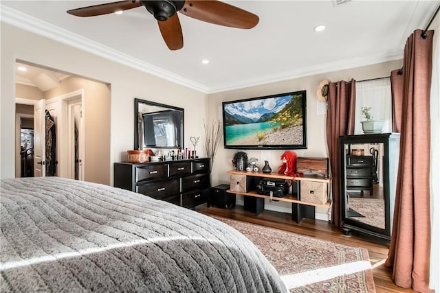 bedroom featuring recessed lighting, crown molding, ceiling fan, and wood finished floors