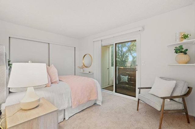 carpeted bedroom featuring access to outside