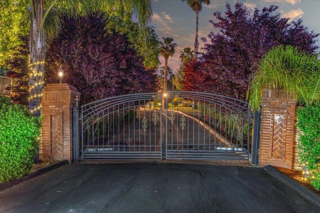 view of gate at dusk