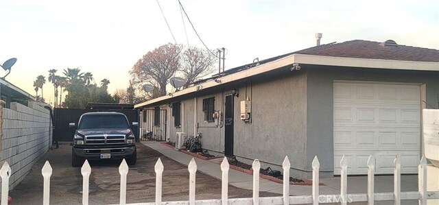 view of property exterior featuring a garage