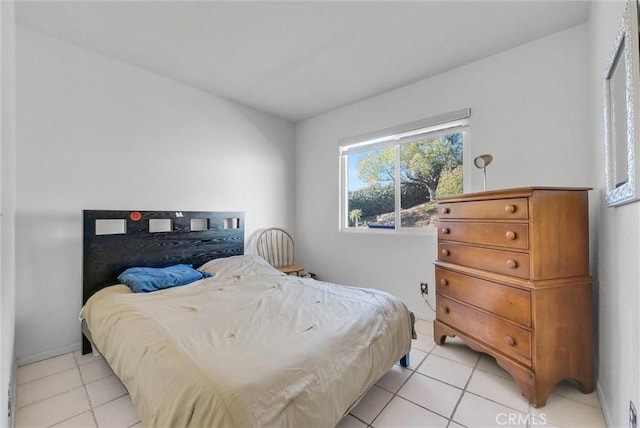 bedroom featuring light tile patterned flooring