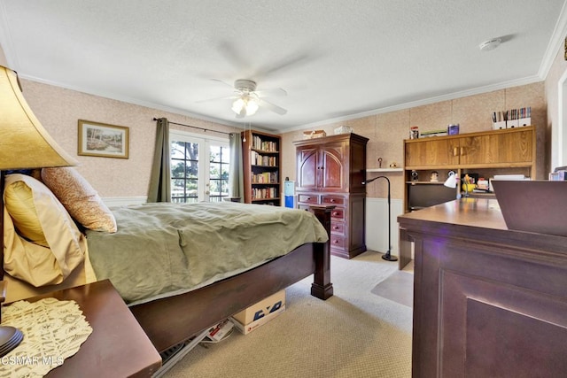 bedroom with ceiling fan, crown molding, light colored carpet, and french doors