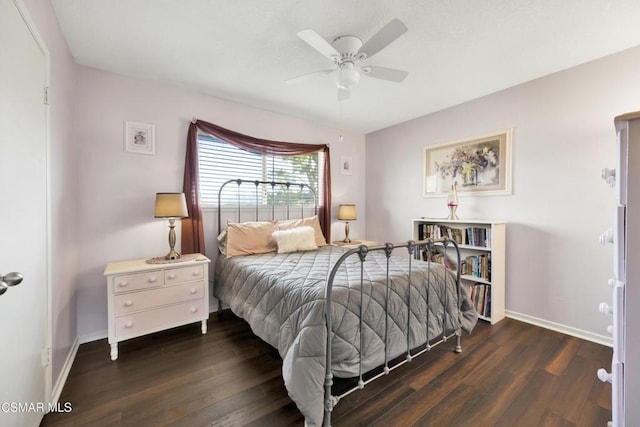 bedroom featuring ceiling fan and dark wood-type flooring