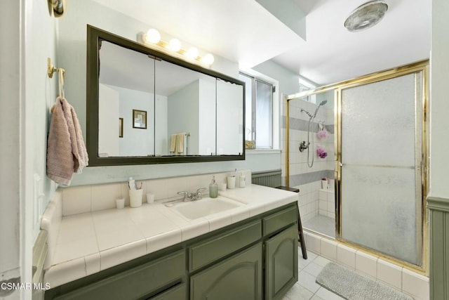 bathroom with vanity, tile patterned floors, and an enclosed shower