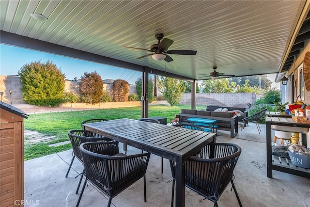 view of patio / terrace featuring ceiling fan and an outdoor living space