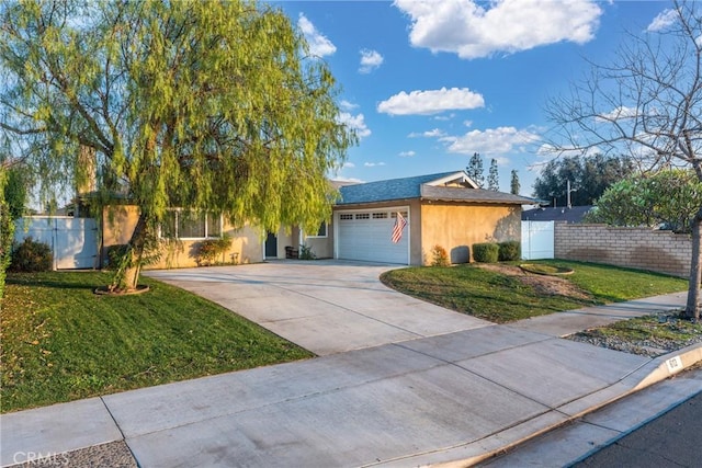 ranch-style house featuring a front lawn and a garage