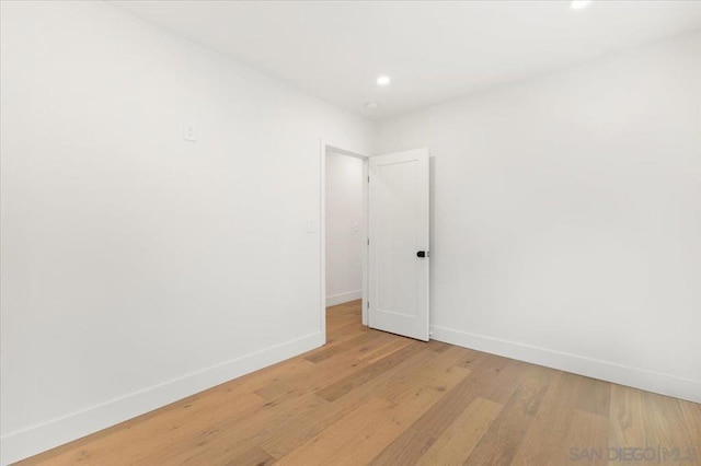 spare room featuring light hardwood / wood-style flooring