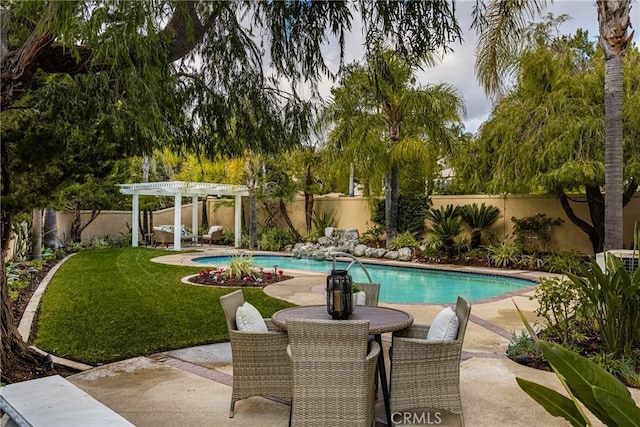 view of pool with a yard, a patio area, and a pergola