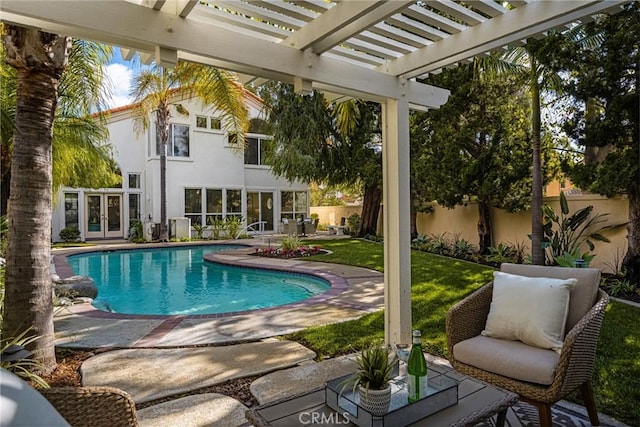 view of pool with a yard, a pergola, and a patio