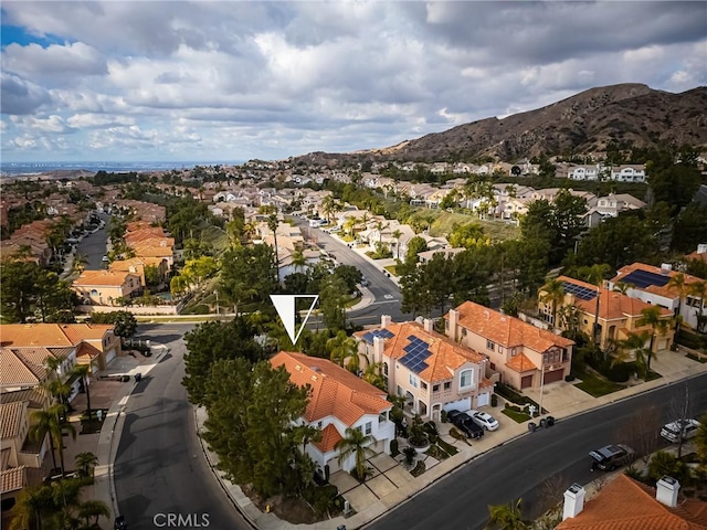 birds eye view of property featuring a mountain view