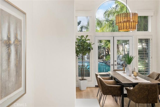 sunroom / solarium featuring french doors