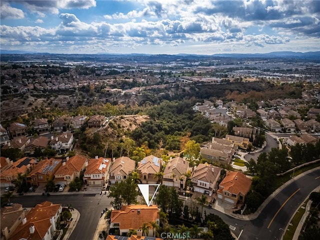 birds eye view of property with a mountain view