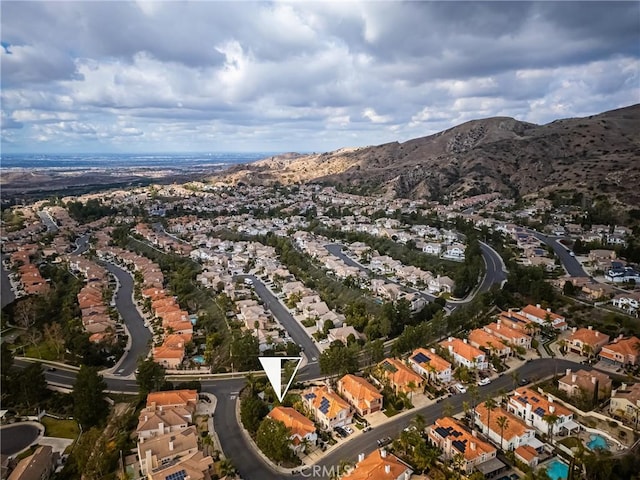 birds eye view of property with a mountain view