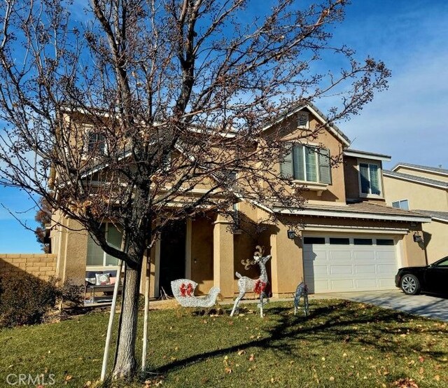 view of front of property featuring a garage, a front yard, and central AC