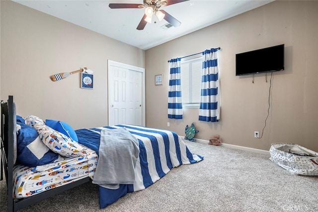 bedroom featuring ceiling fan, carpet flooring, and a closet