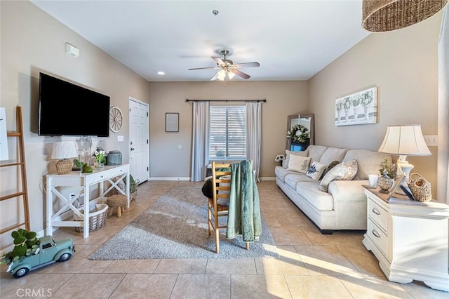 living room featuring ceiling fan and light tile patterned floors