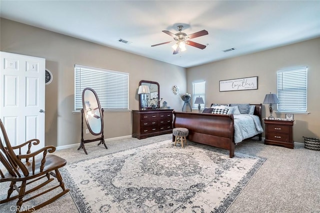 bedroom with ceiling fan and light colored carpet