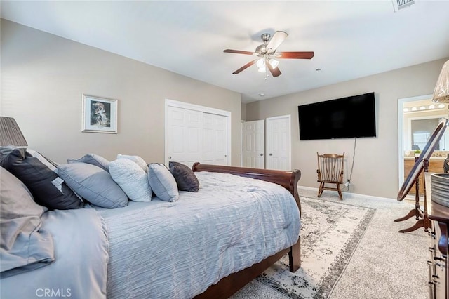 carpeted bedroom featuring ceiling fan