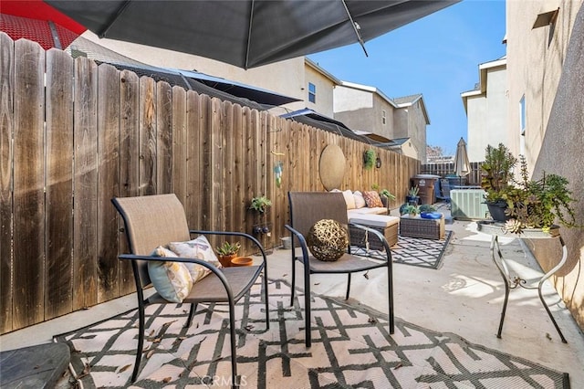 view of patio / terrace with an outdoor hangout area and central air condition unit