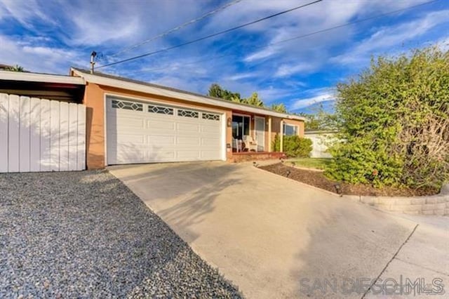 ranch-style home with a garage