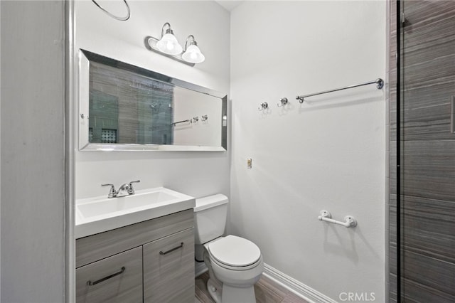 bathroom with toilet and vanity