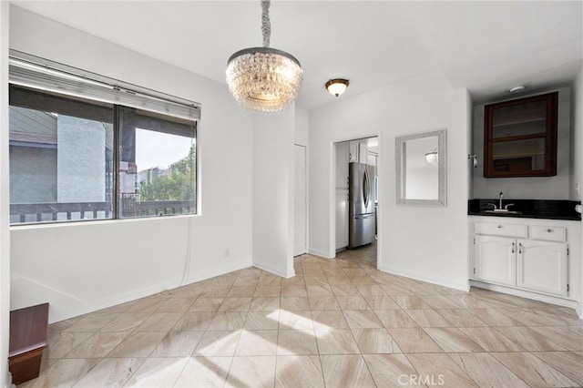 interior space featuring sink and a notable chandelier