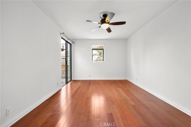 spare room featuring ceiling fan and hardwood / wood-style floors