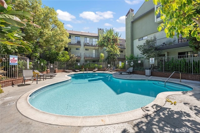 view of pool featuring a patio