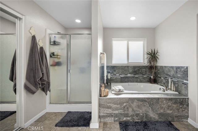 bathroom with shower with separate bathtub