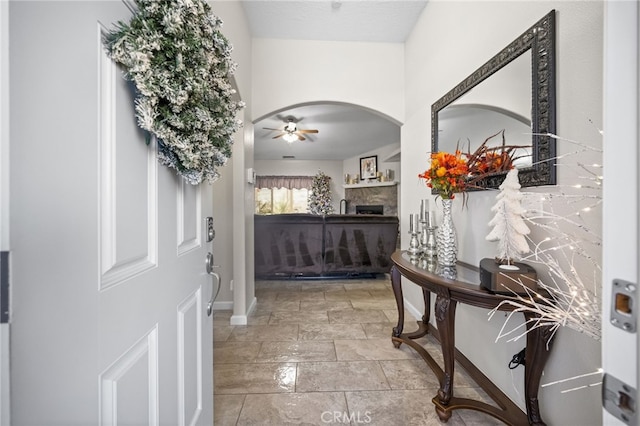 interior space with ceiling fan