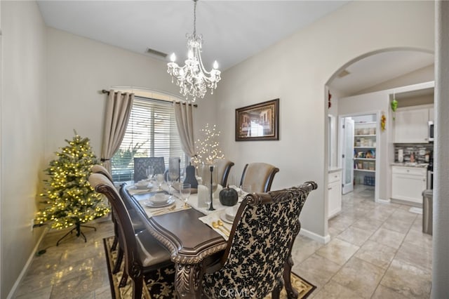 dining space featuring an inviting chandelier